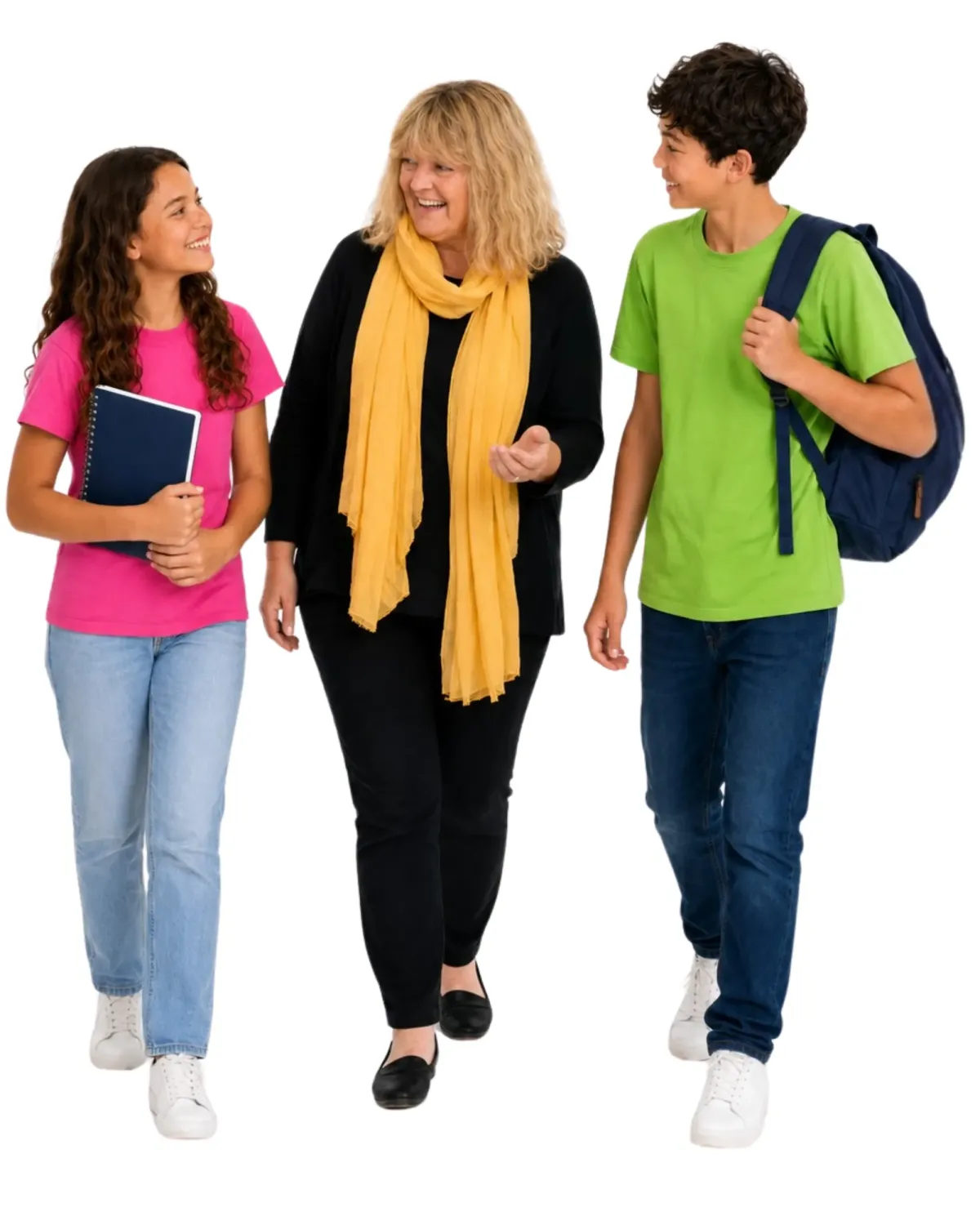 Lozz Kennedy walking and talking with two secondary school-aged students carrying a notebook and backpack.