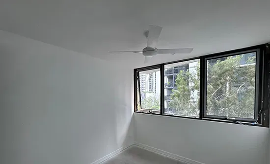 Spacious living room transformed with interior house painting in Brisbane