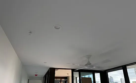 Bright white ceiling repainted as part of an interior house painting project in Brisbane