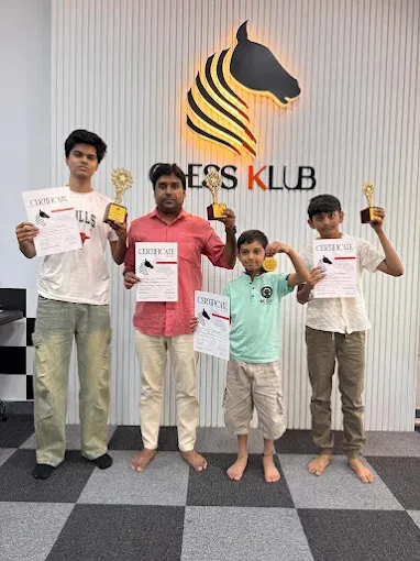 Students at CHESS KLUB with certificate on a Stage