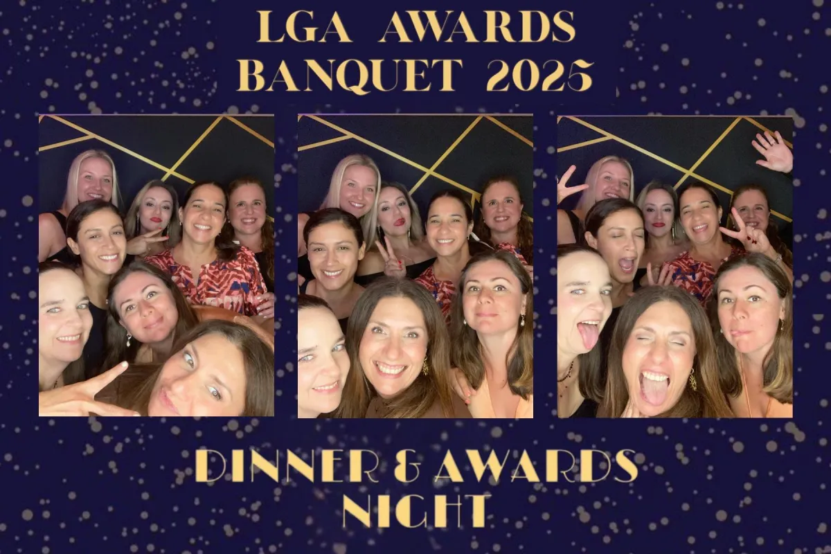 Attendants waiting in line in an upscale lobby, soft ambient lighting and a visible branded booth in the background, composition focused on event flow and guest anticipation to illustrate smooth operation.