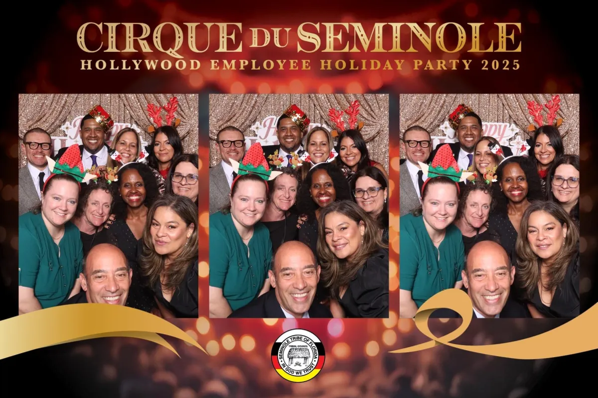 Elegant guests in evening wear pose with gold confetti, illuminated by soft studio lighting at a Miami gala. The image captures the glamour and sophistication of the event, with rich textures and a celebratory mood unique to upscale Miami gatherings.