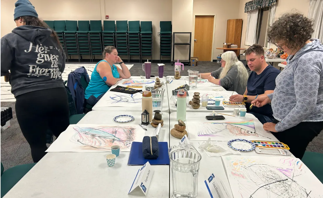people sitting at tables during a training