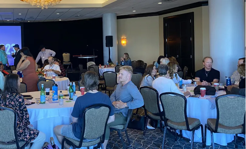 people sitting at round tables during workshop