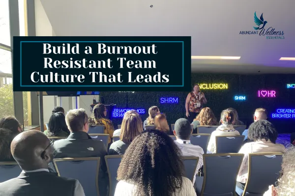 Build a Burnout Resistant Team Culture That Lasts with a picture of an audience listening to a speaker