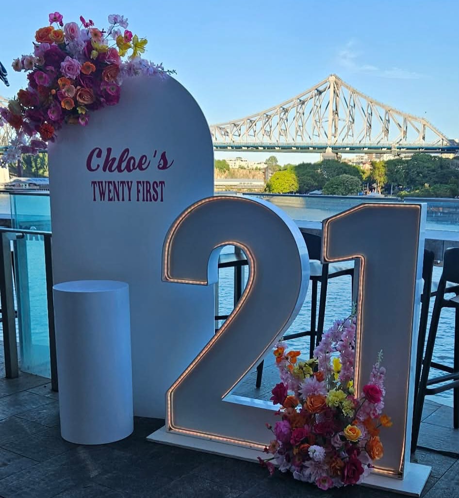 Light-up number display for 21st birthday celebration with balloon backdrop, event styling by All Occasions by Nic.