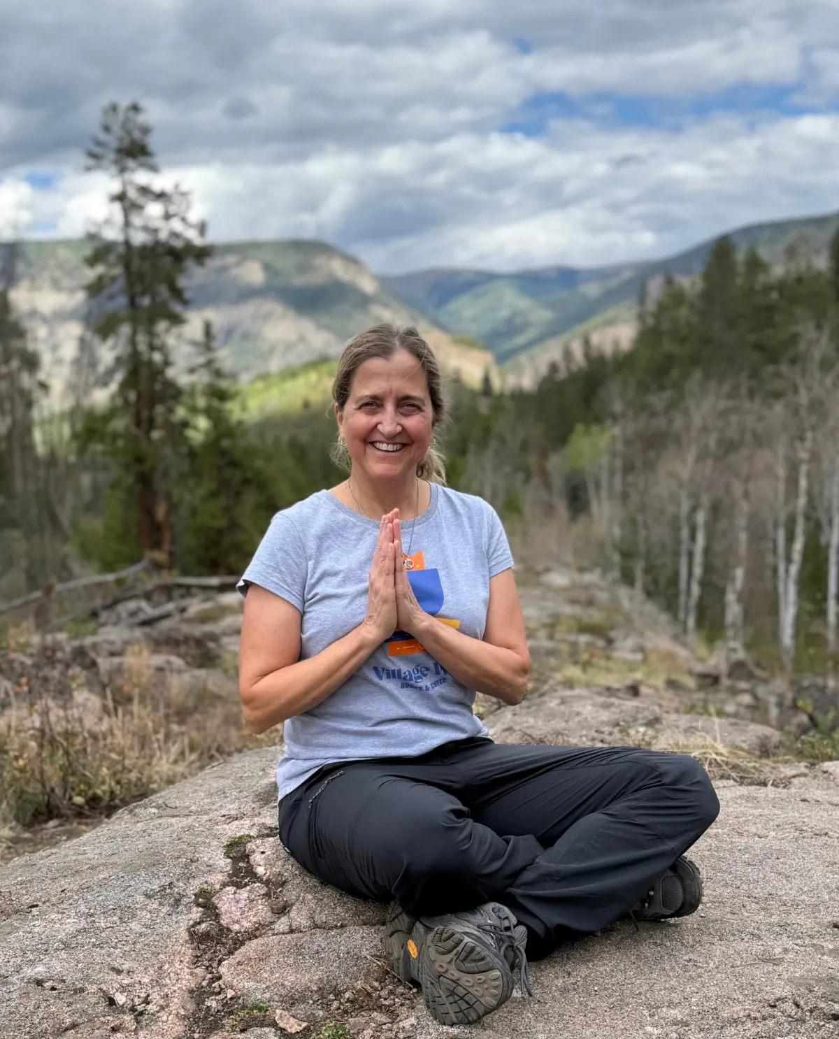 Portrait of the yoga instructor, a mature woman smiling warmly