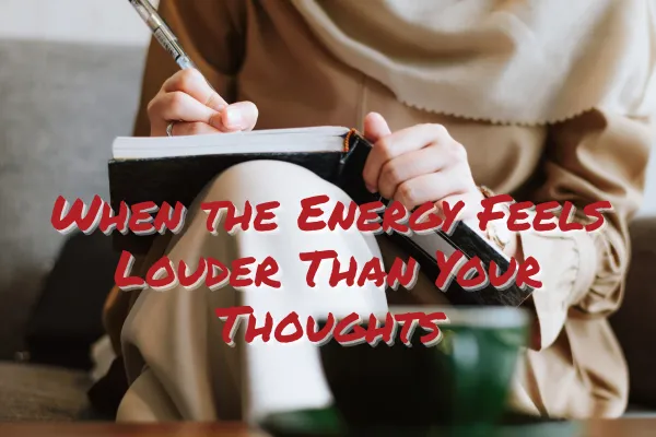 Woman reflecting with coffee while planning her business during Saturn Retrograde and intense collective energy.