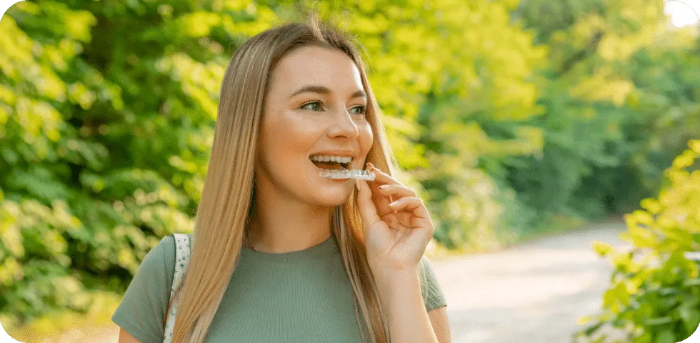a kitchen with a sink and a lot of clutter on the counter
