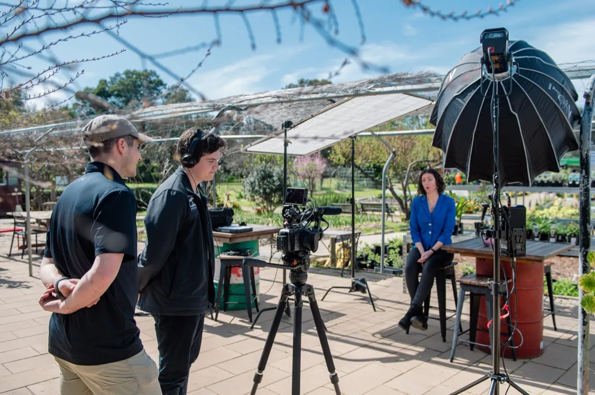 Crew preparing the nursery interview with overhead diffusion and a softbox