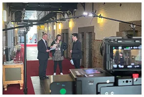 Filming a presenter in a heritage foyer