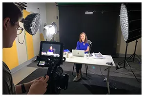 Shooting a presenter at a desk with a monitor rig