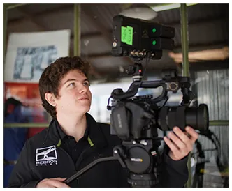 Henry operating a cinema camera in a studio