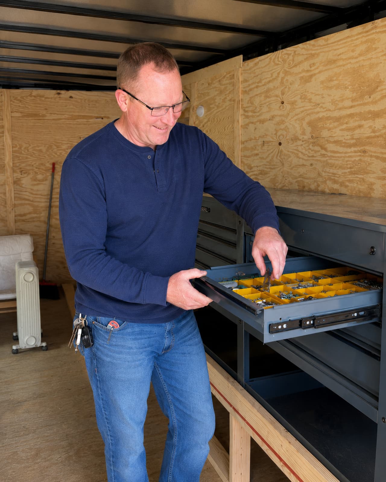 Mitch efficiently cutting materials at the mobile workshop