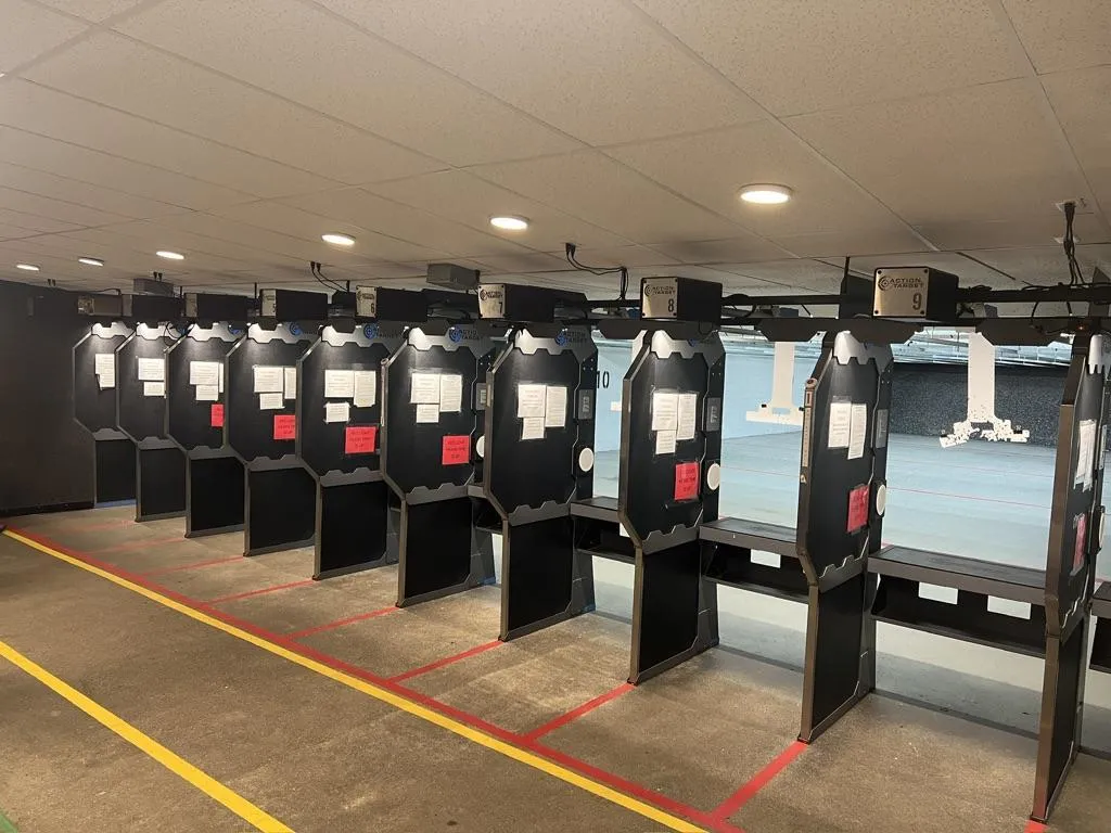 Hands using a digital caliper to measure metal part.