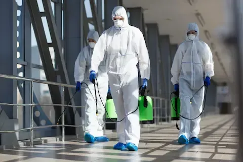 Team in hazmat suits performing commercial mold removal – Huntsville Mold Removal Pros.