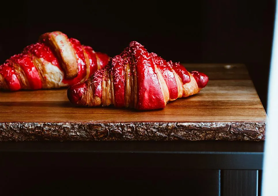 a close up of two pastries on a plate