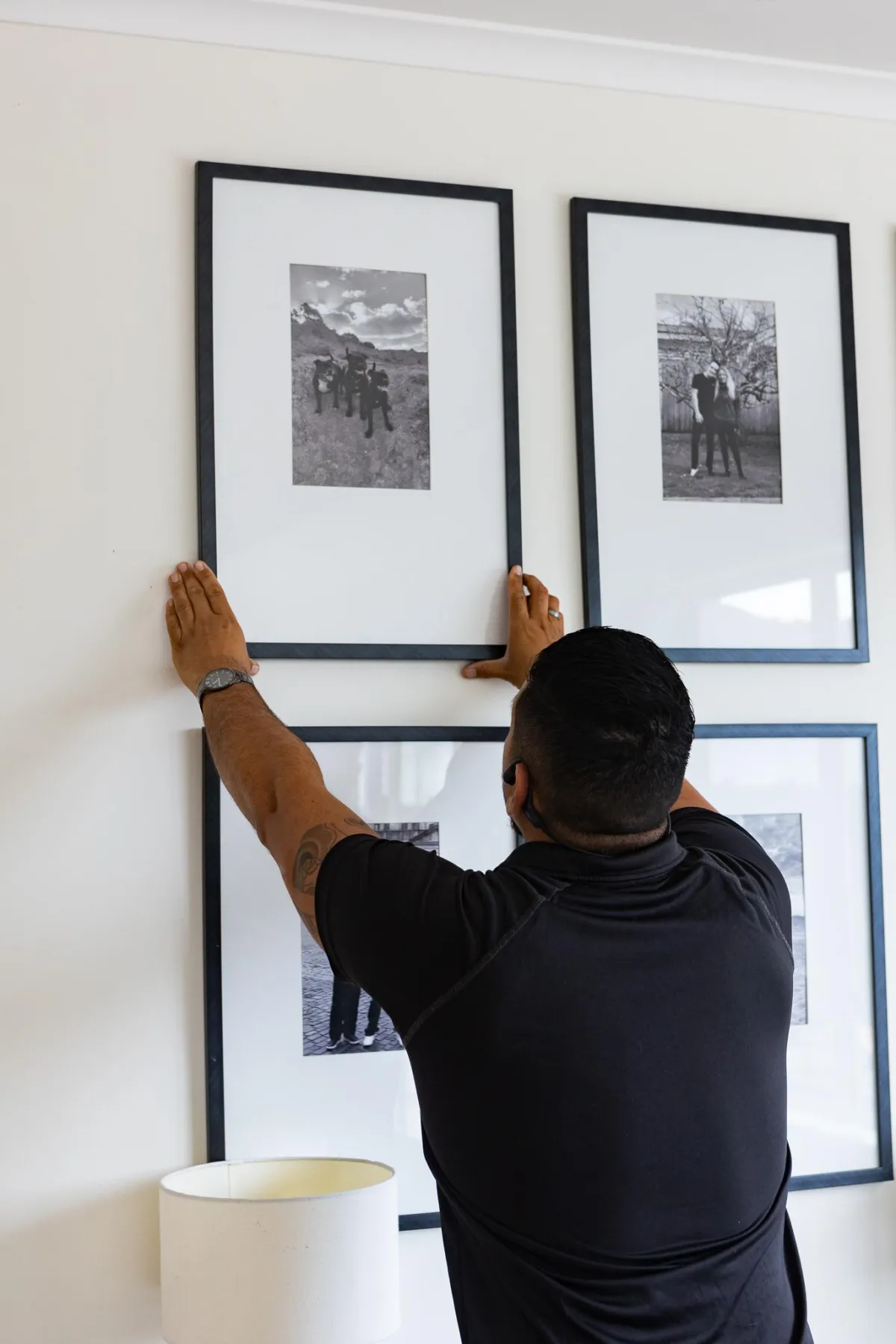 Person sealing a cardboard box with tape, illustrating professional packing services for stress-free moving in Auckland.