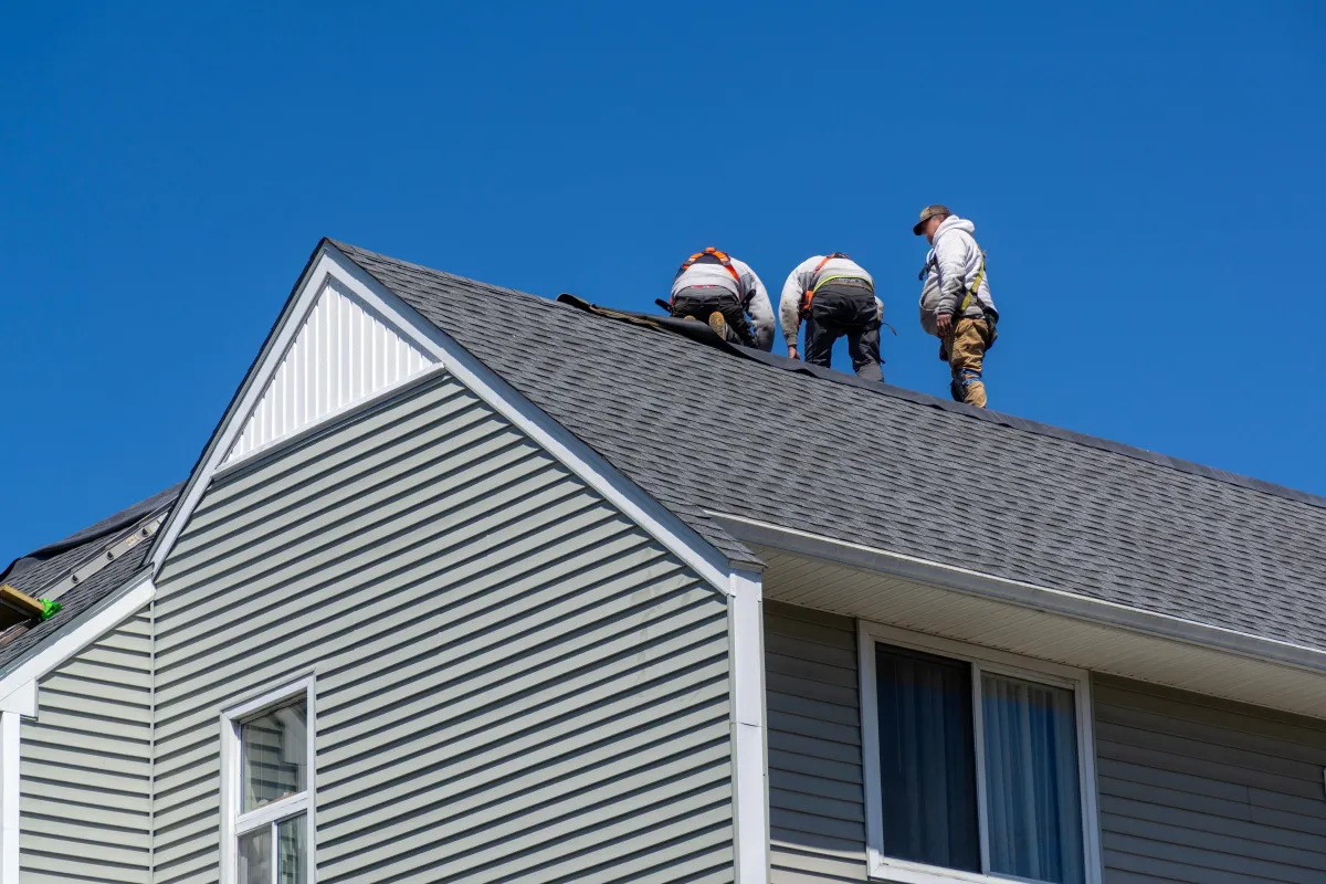 a close up of a roof with a blue sky in the background