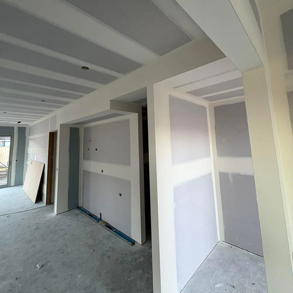 Renovation plastering blending old and new walls in Christchurch interior