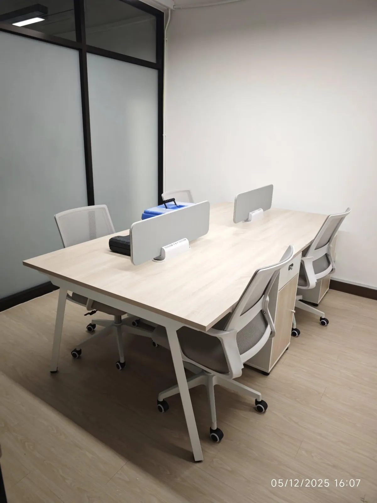 three women sitting beside wooden table