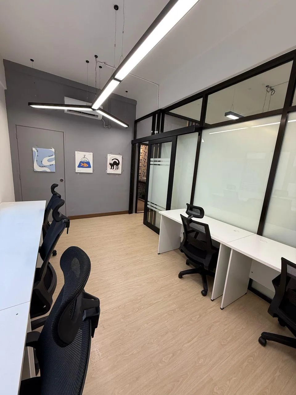 man in blue long sleeve shirt holding smartphone