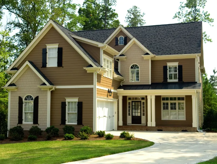 Two story home with seamless exterior addition blending with original design built to expand living space and increase property value