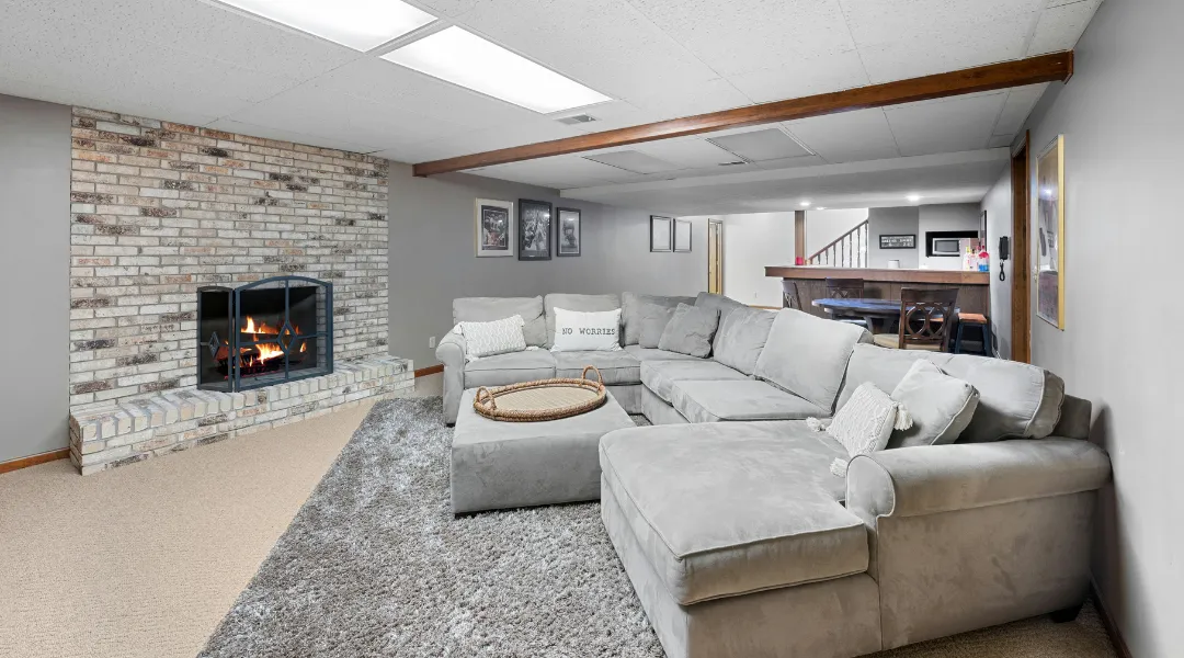 Charming custom suburban home with a spacious front yard, elegant architecture, and a warm, inviting design for comfortable family living.