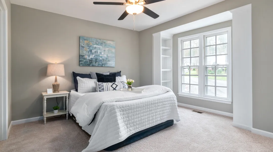 Charming custom suburban home with a spacious front yard, elegant architecture, and a warm, inviting design for comfortable family living.