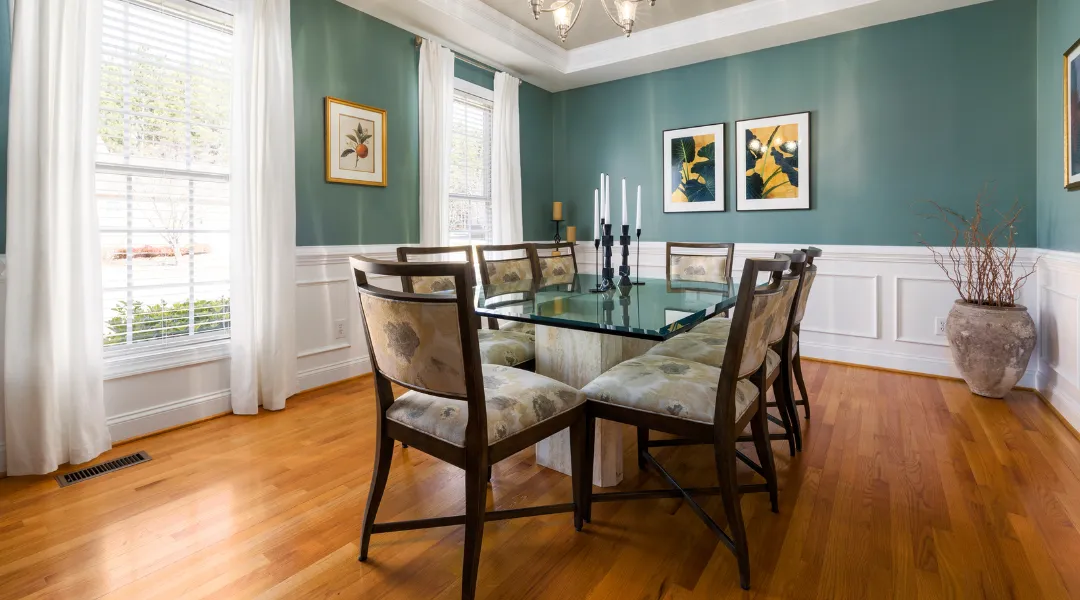 Charming custom suburban home with a spacious front yard, elegant architecture, and a warm, inviting design for comfortable family living.