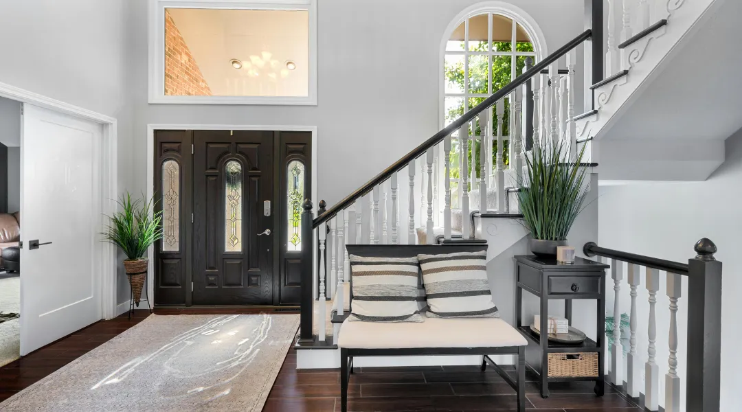 Charming custom suburban home with a spacious front yard, elegant architecture, and a warm, inviting design for comfortable family living.