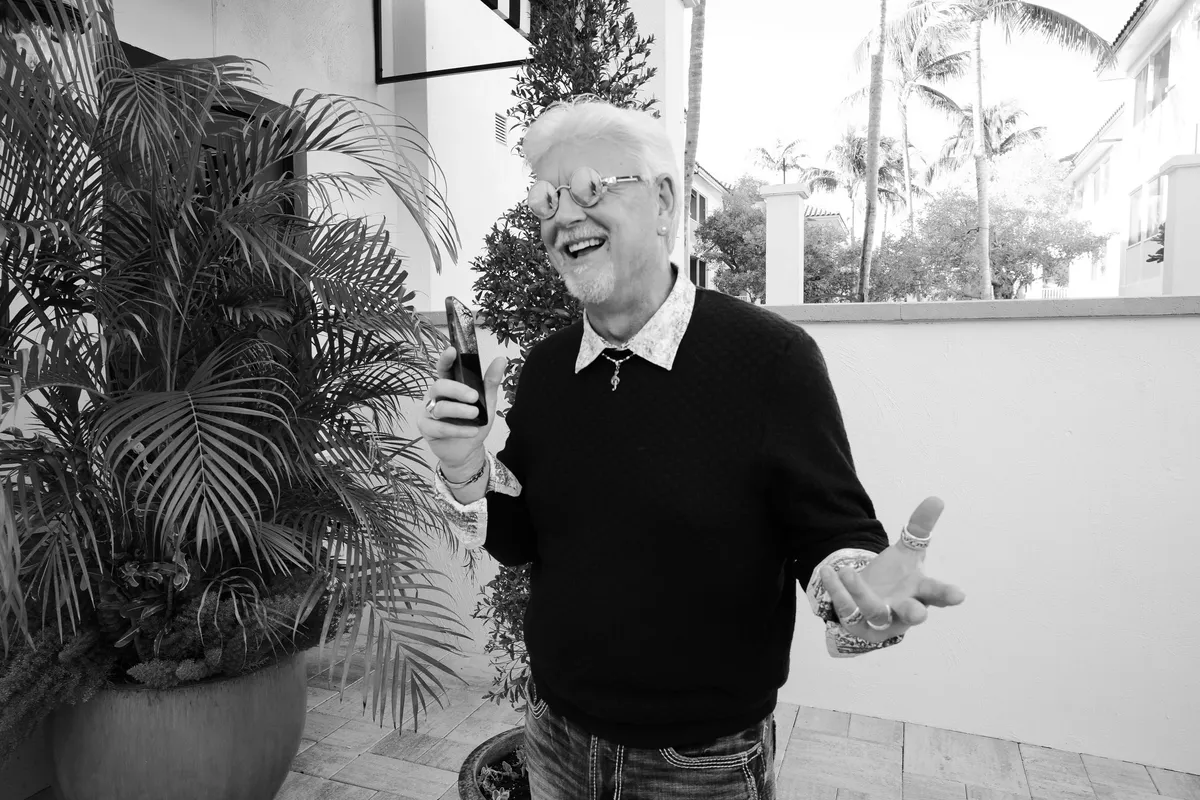 Bruce Cramer, business and leadership coach, seated outdoors
