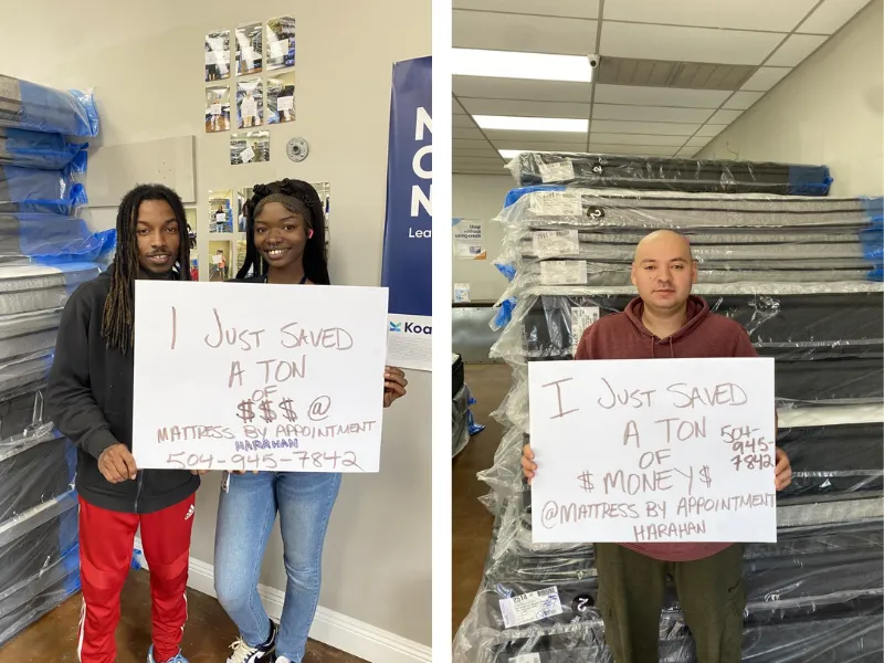 customers holding a sign that says 'I just saved a bunch of money at mattress by appointment henderson'