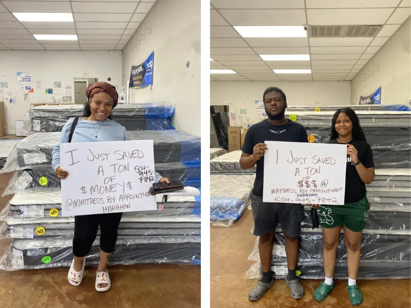 customers holding a sign that says 'I just saved a bunch of money at mattress by appointment henderson'