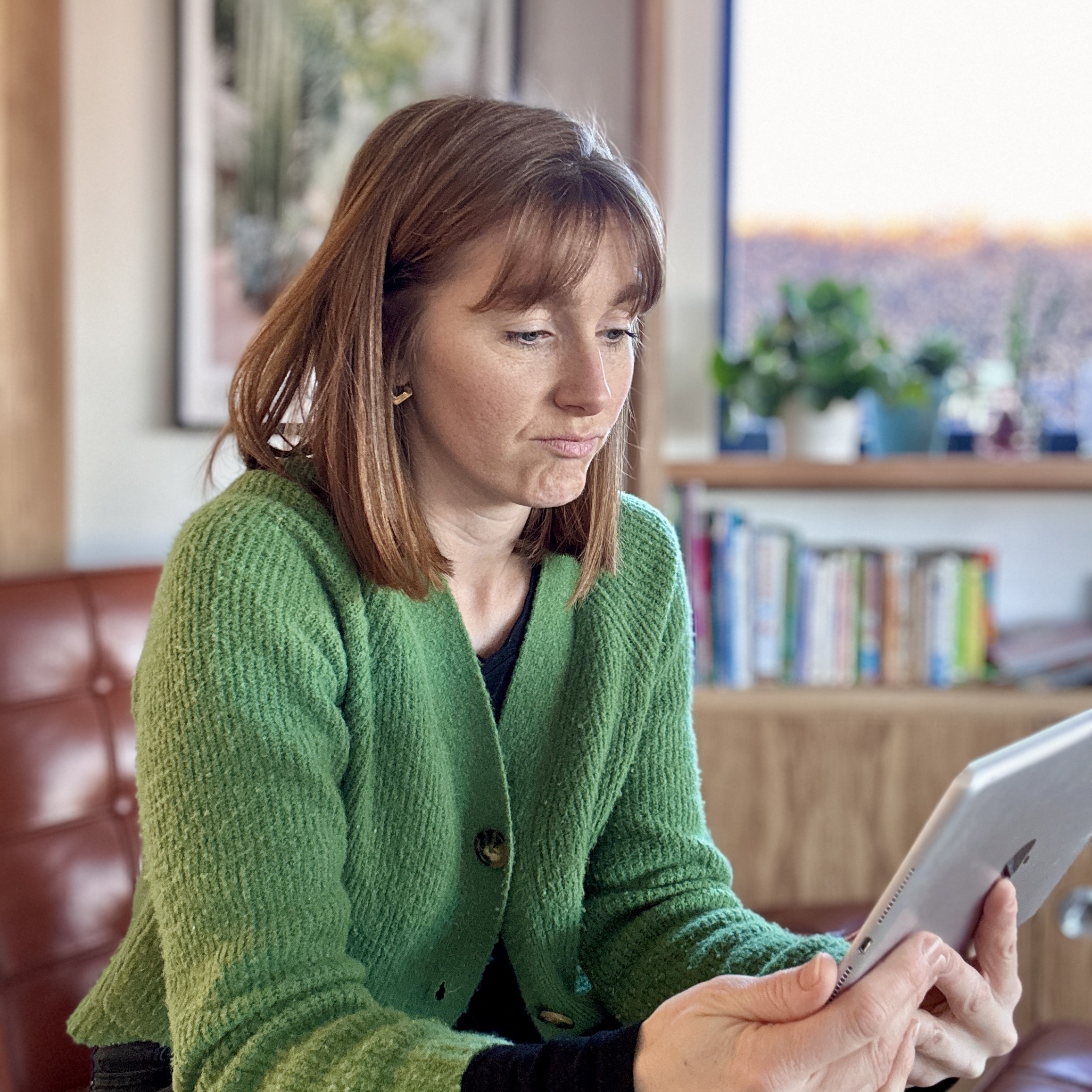 Frustrated family photographer looks at their accounts for the year