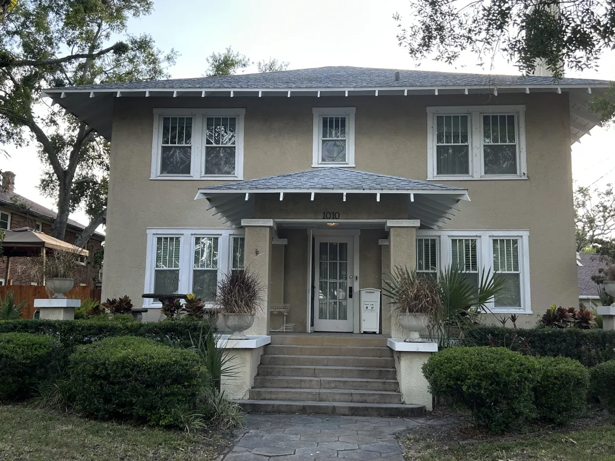 mid size house with tan stucco