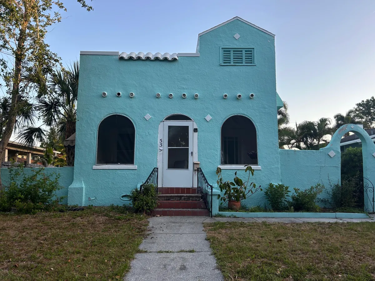 house with baby blue stucco 