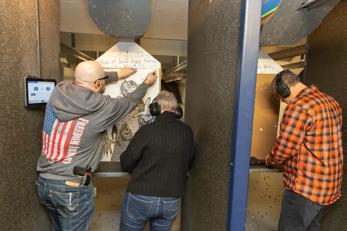 man in blue jacket riding bicycle on dirt road during daytime