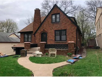 house ehind lots of spring trees