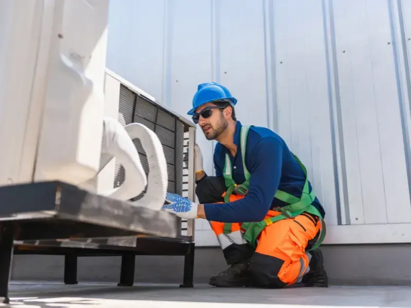 Halcomb Property Inspections inspector assessing a commercial building rooftop HVAC unit in Phoenix AZ