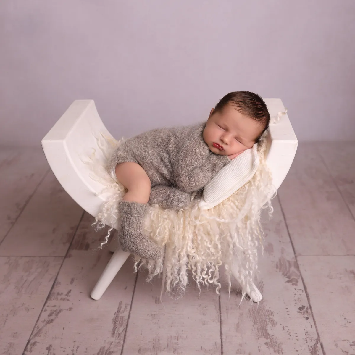 Photo of baby sleeping on its back, taken by Ipswich baby photographer