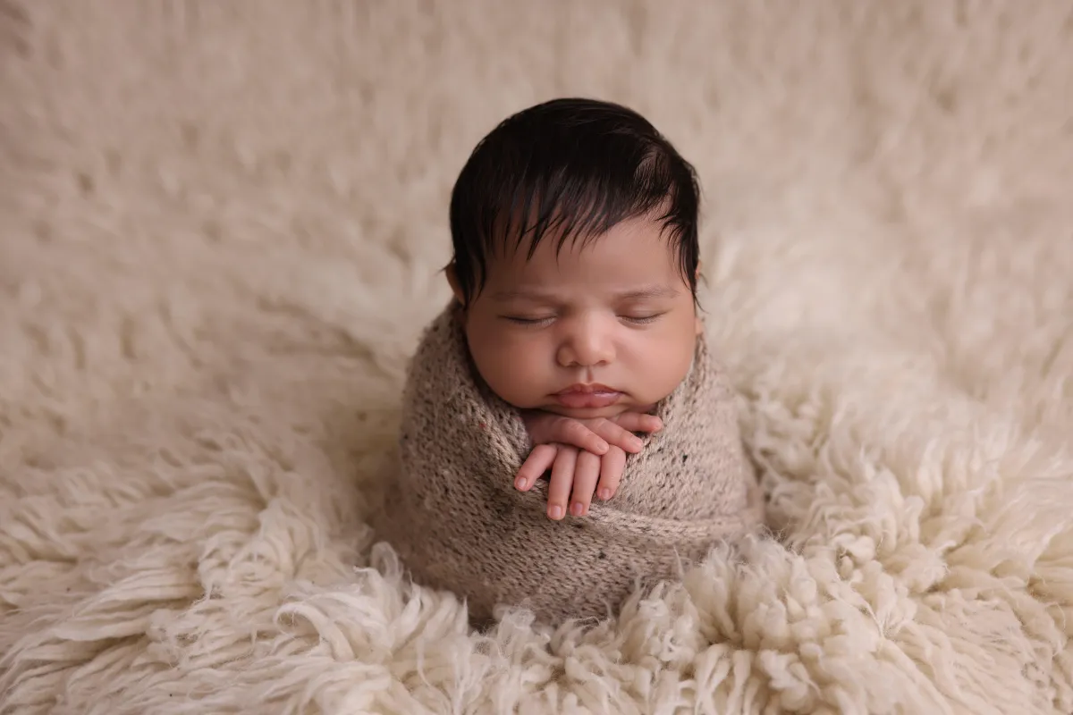 Photo of baby sleeping on its back, taken by Ipswich baby photographer