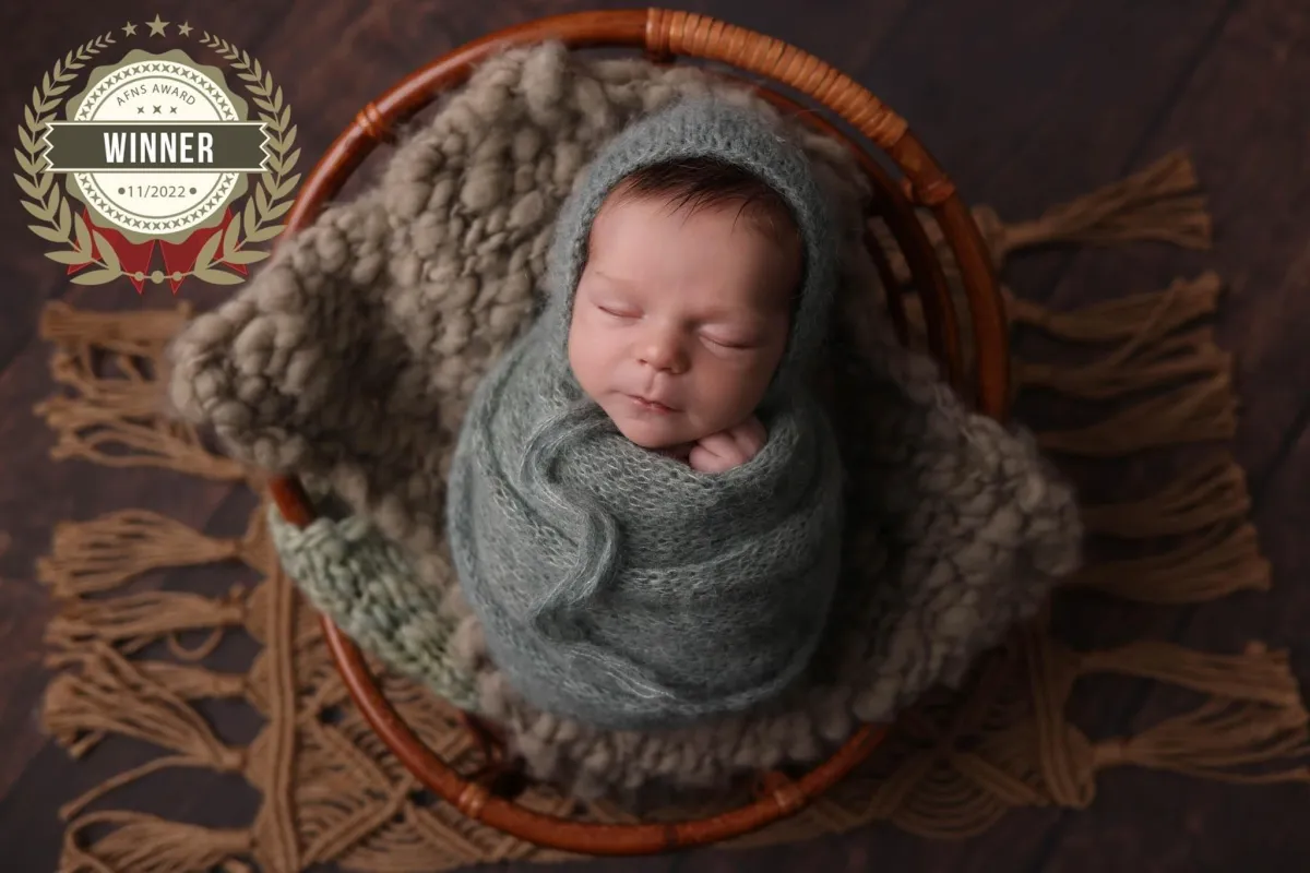 Photo of baby sleeping on its back, taken by Ipswich baby photographer