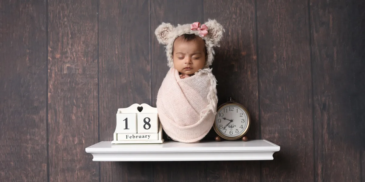 Baby sleeping on shelf - taken by professional photographer in Loughborough