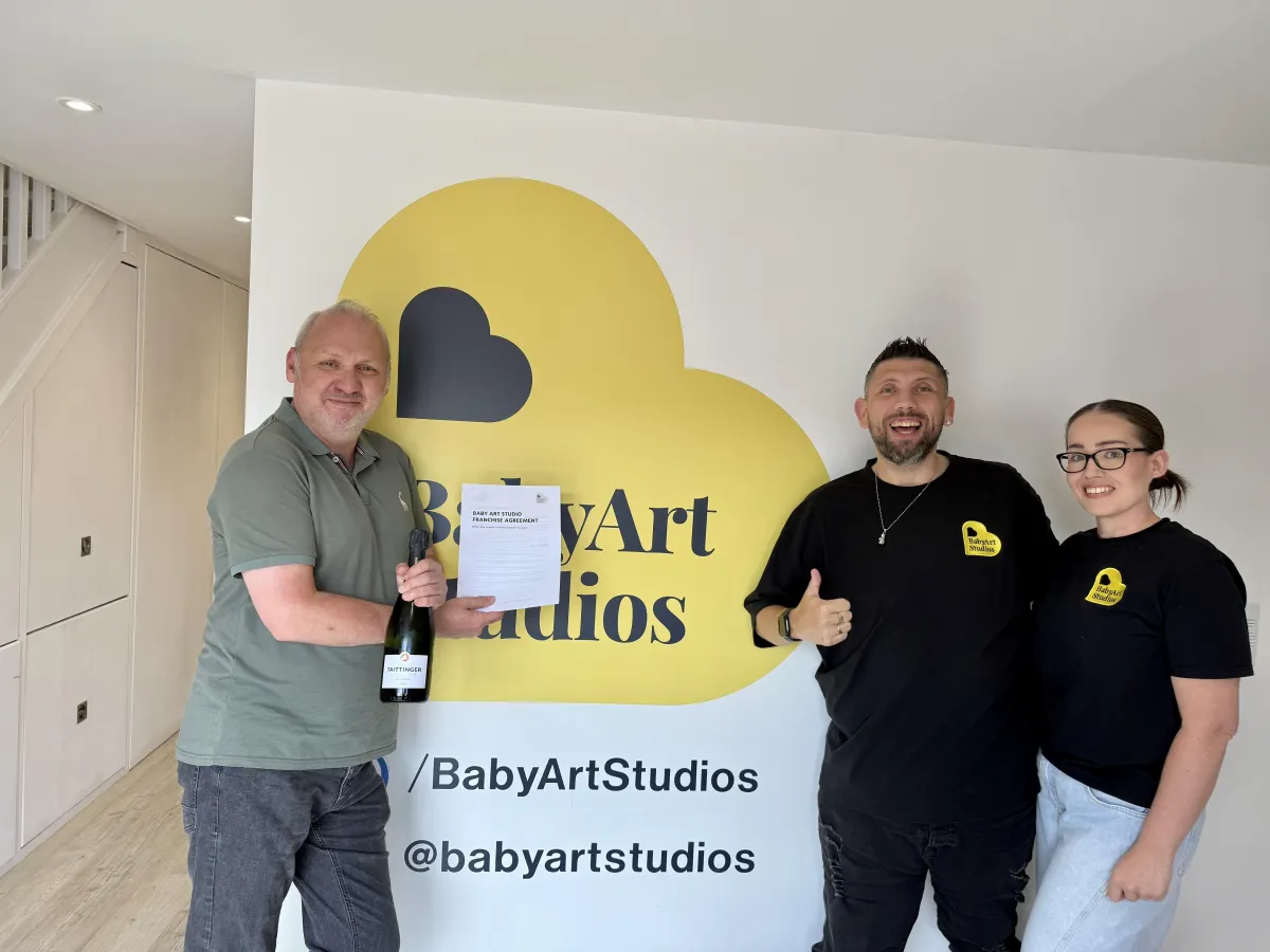 Newborn photography session setup at Baby Art Studios in the UK, showcasing tranquil poses and family moments.