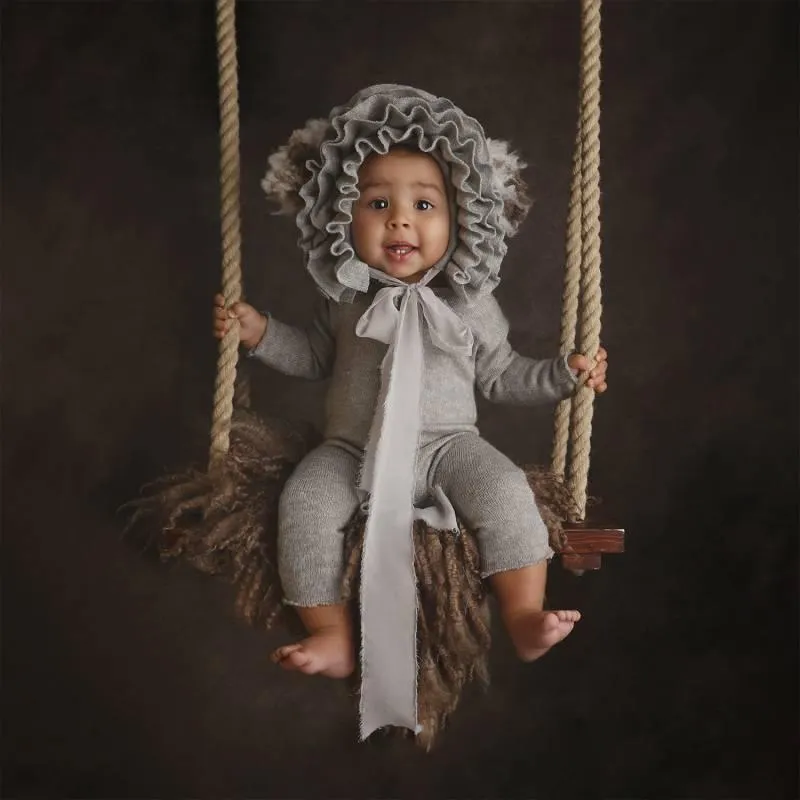 Photo of baby sitting on swing for Baby Art Studios Gallery