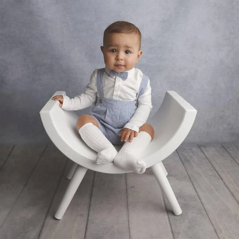 Baby sitting on a chair for Baby Art Studios Gallery