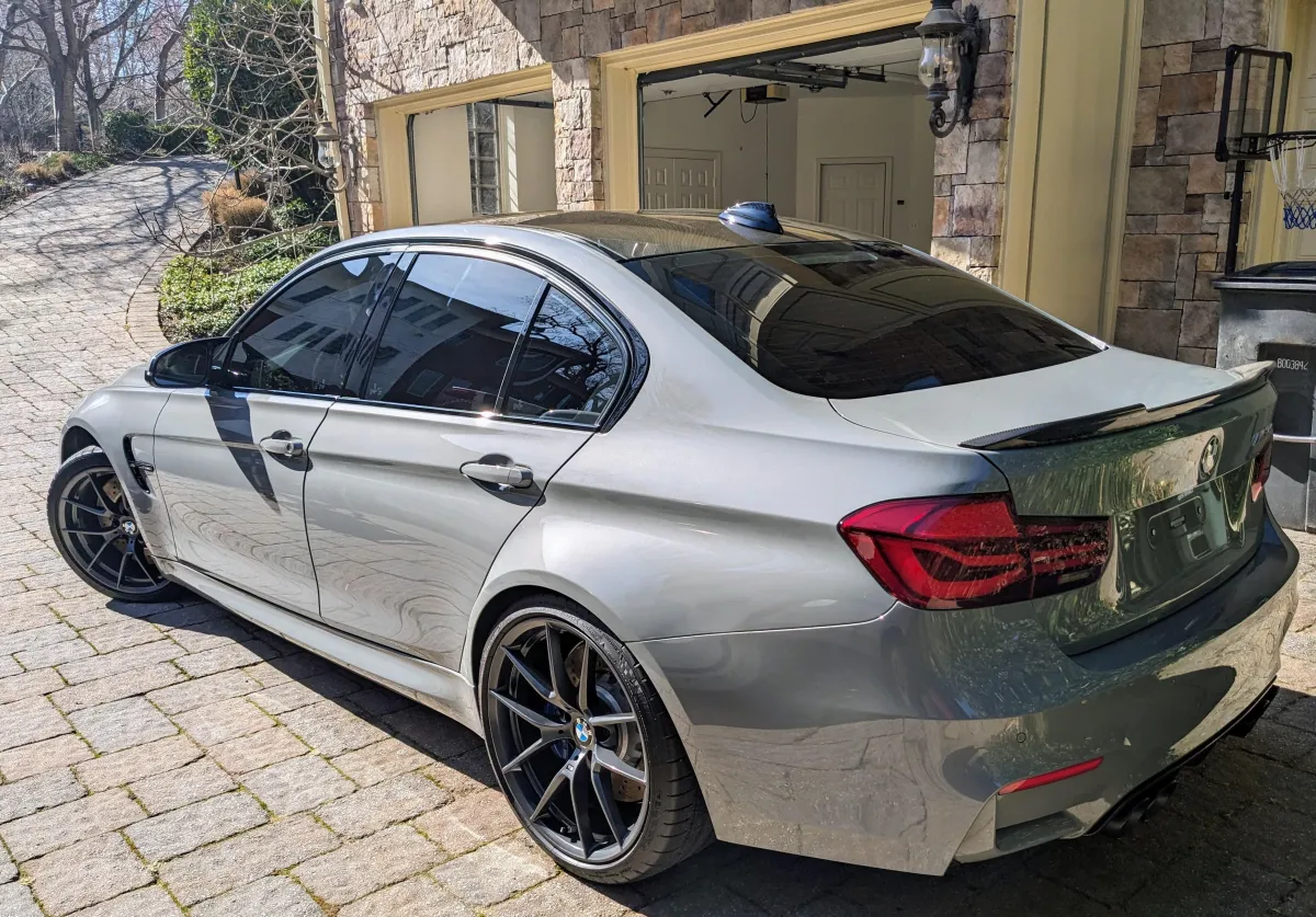 gray bmw 3 cs outside sunny