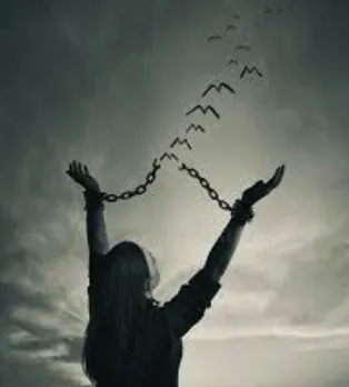 Woman breaking free of chains by re-finding herself