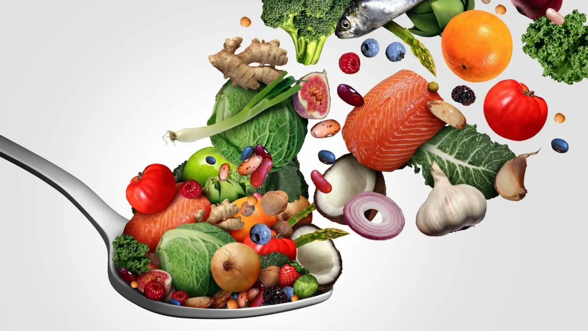 Colourful fresh vegetables on a spoon, representing an anti-inflammatory whole-food diet